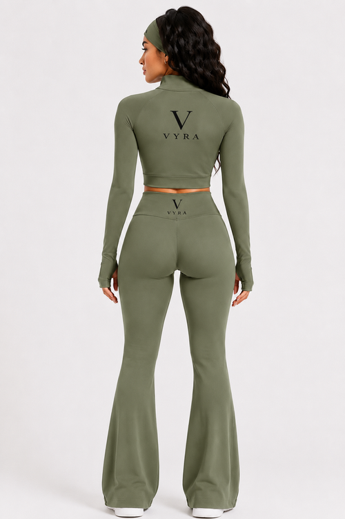 Back view of the VYRA Signature Sculpt Set in Sage Green with high-waist flare leggings and sculpting performance fabric.
